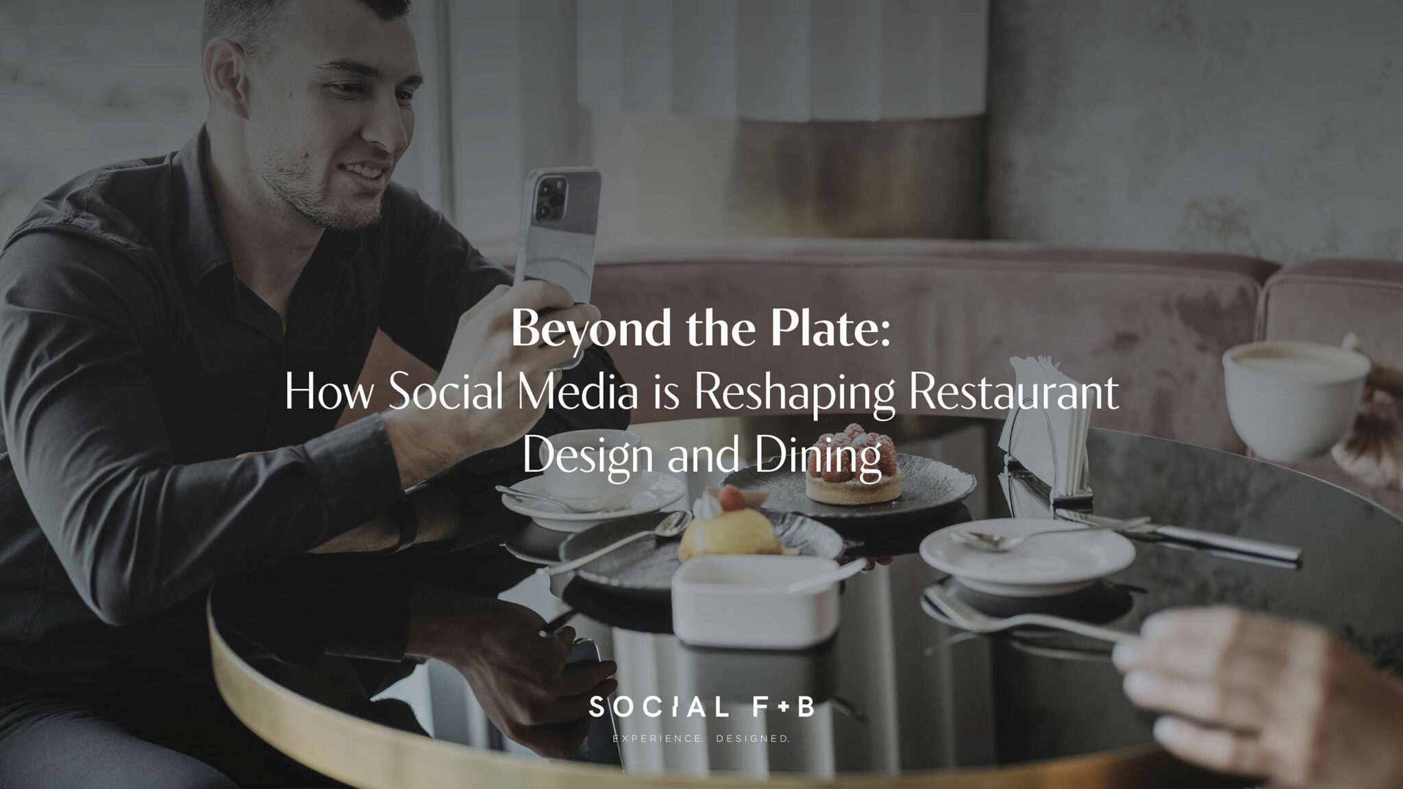 A guest photographs pastries on a glossy black café table while another person holds a cup of coffee, with the article title “Beyond the Plate: How Social Media is Reshaping Restaurant Design and Dining” overlaid—illustrating how social behaviour influences modern hospitality design and dining experiences.