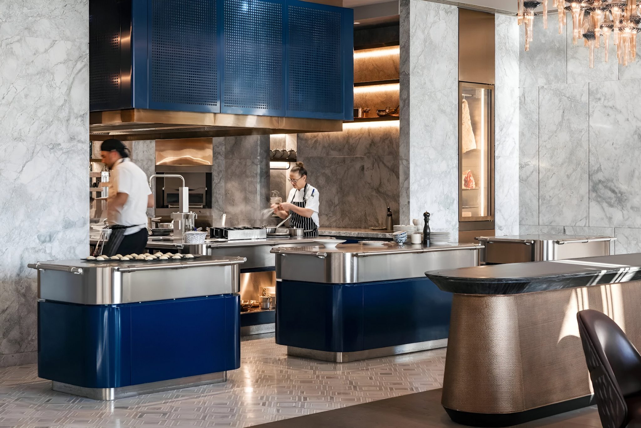 Completed open cooking station at La Veranda, One&Only Montenegro, highlighting marble surfaces, blue metal accents, and live culinary theatre designed by Social F+B.