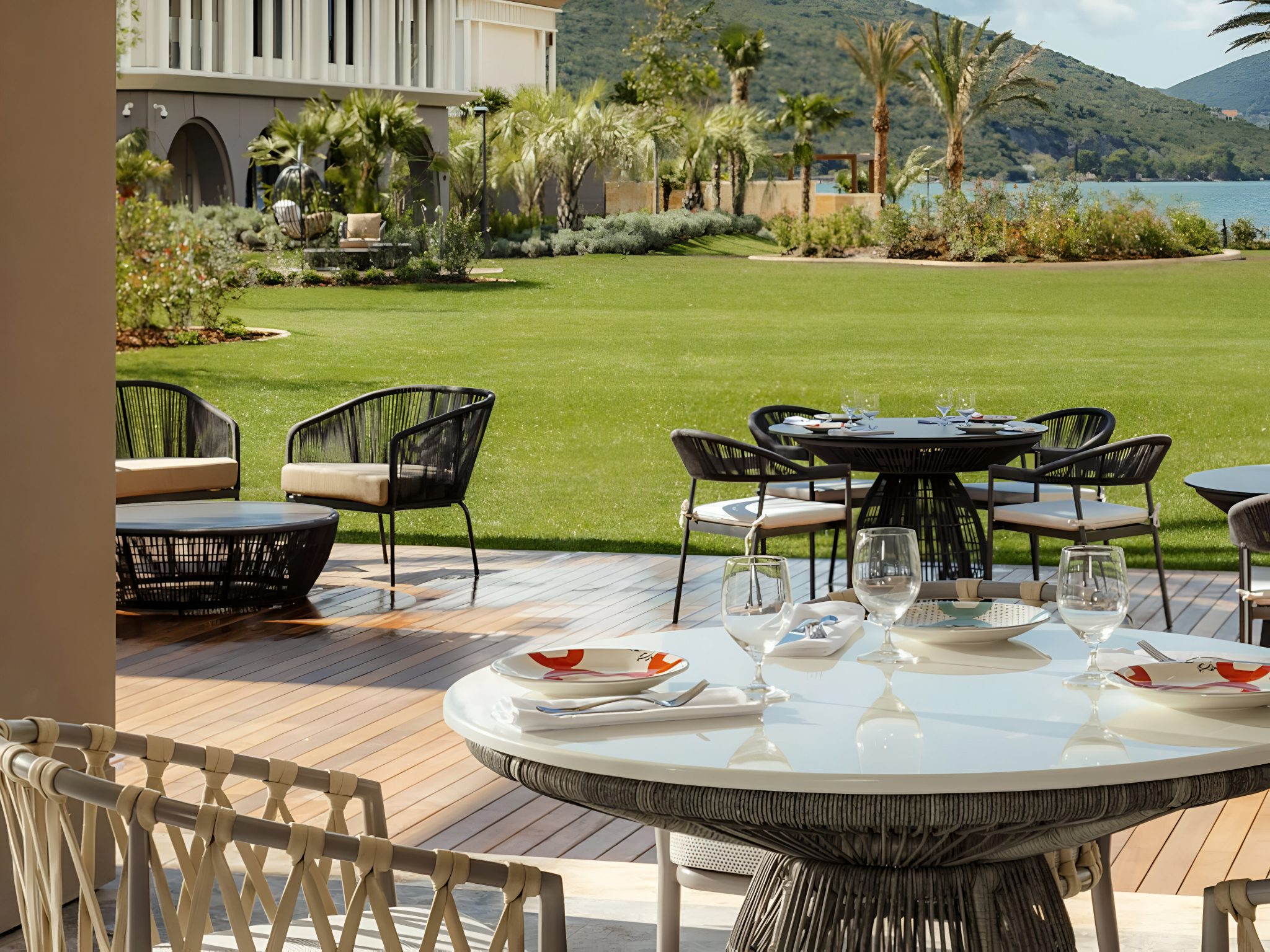 Outdoor dining area at La Veranda, One&Only Montenegro, with modern terrace seating and landscaped gardens by Social F+B.