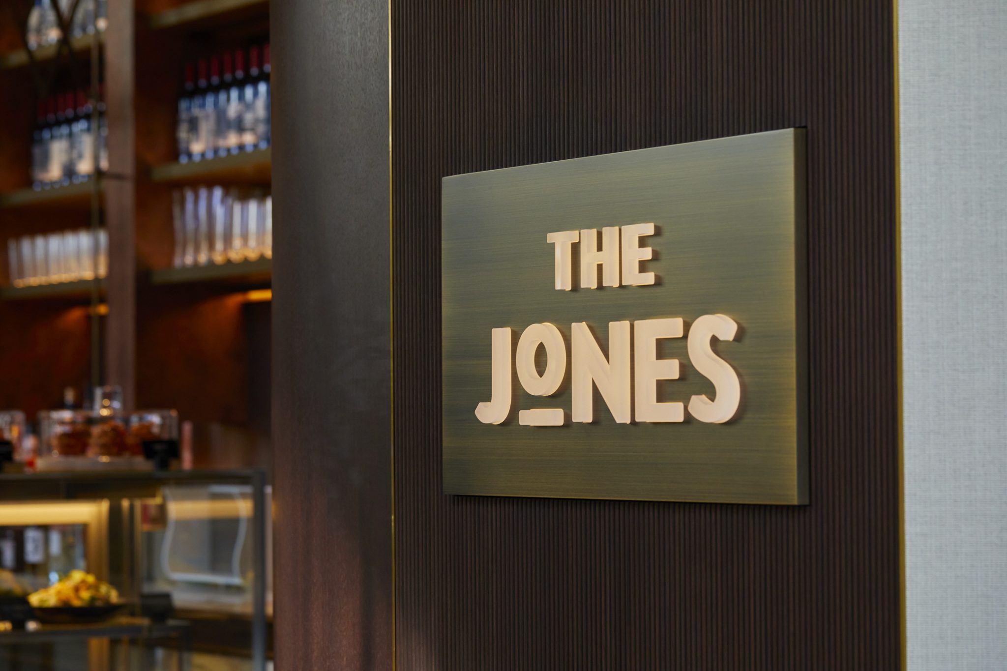 Illuminated signage for The Jones café and bar at Kimpton Shinjuku Tokyo, showcasing contemporary branding and interior design—an example of Social F+B’s hospitality concept development and restaurant branding work.