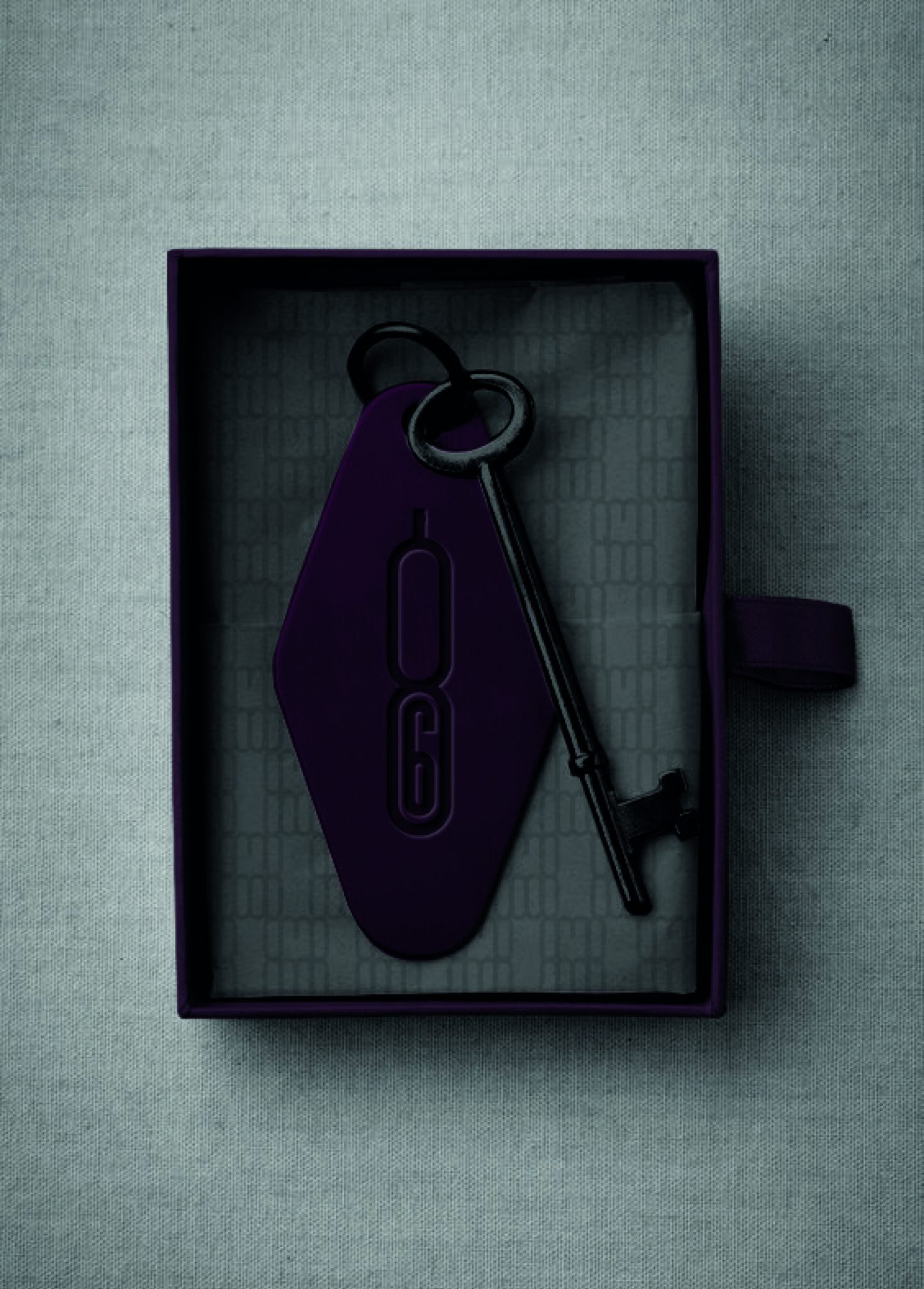 Custom branded key and coffin-shaped key fob presented in a bespoke purple box for 86 at Kimpton Shinjuku, showcasing tactile brand collateral inspired by mystery, exclusivity, and classic speakeasy symbolism.