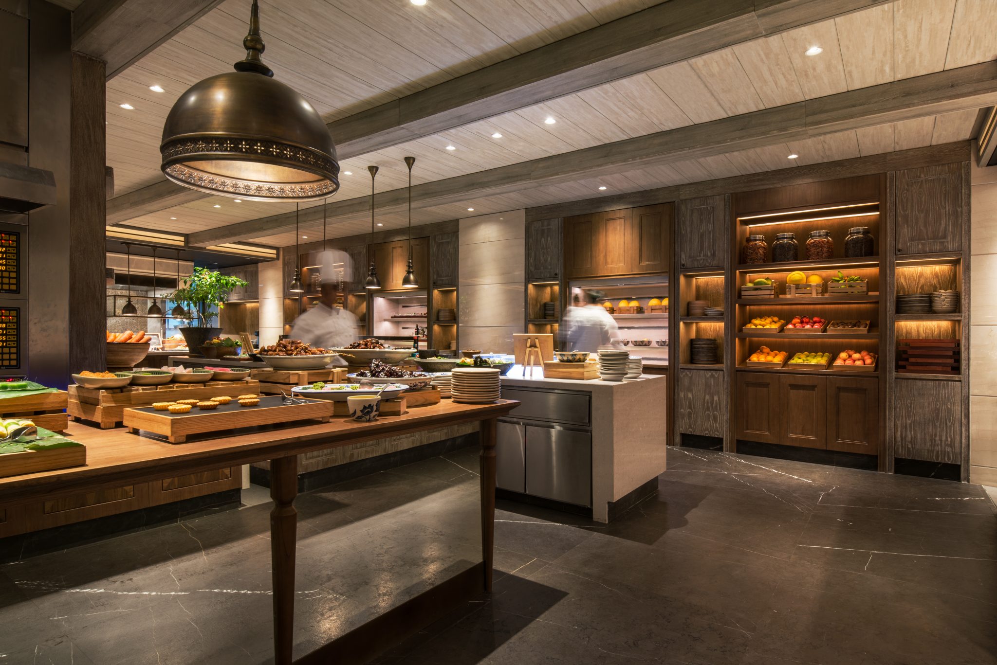 Live buffet area at Grand Café, Grand Hyatt Jakarta, designed by Social F+B with open preparation counters, market-style displays, and a layout that creates a sense of culinary theatre.