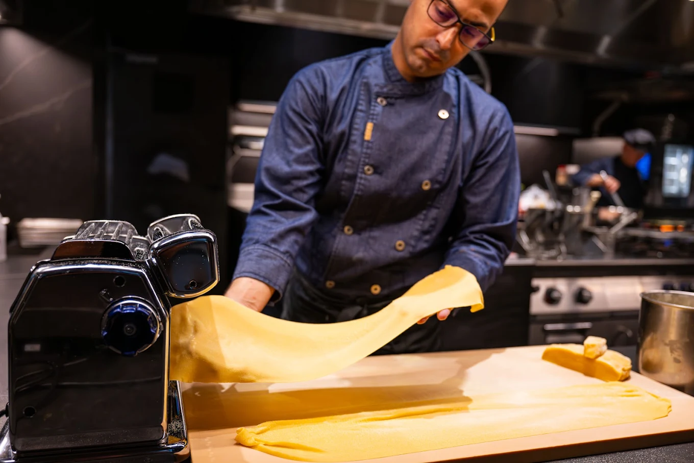 Chef making pasta in Lokal House Voco Hotel Osaka